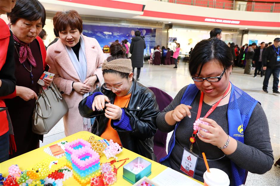 Domestic helpers celebrate International Women's Day inside Oriental Pearl