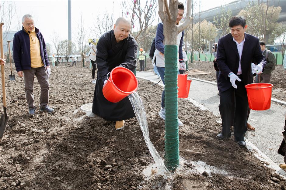 City temple hosts tree planting to promote 'green lifestyle'