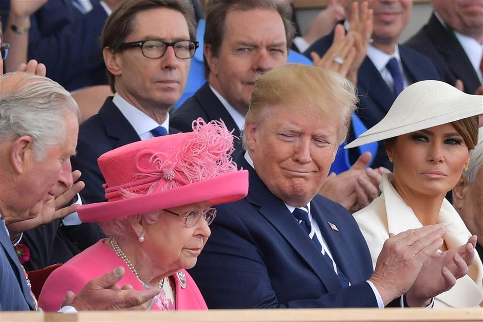 Trump, Queen lead emotional tributes to D-Day heroes