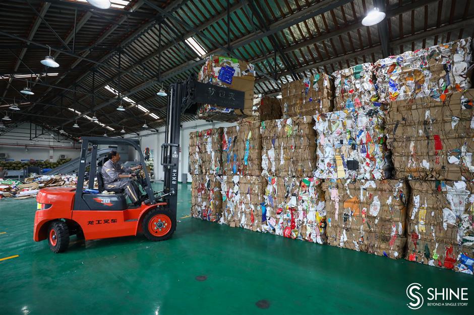 Tons of recyclables sorted by hand in Jiading center