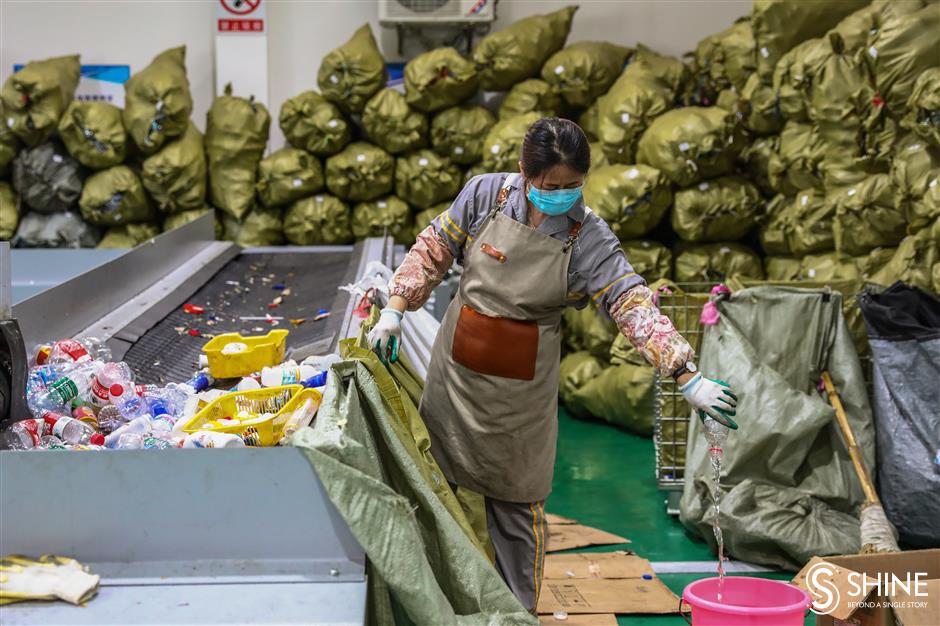 Tons of recyclables sorted by hand in Jiading center