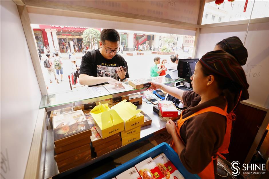 Customers having their mooncakes and eating them, too