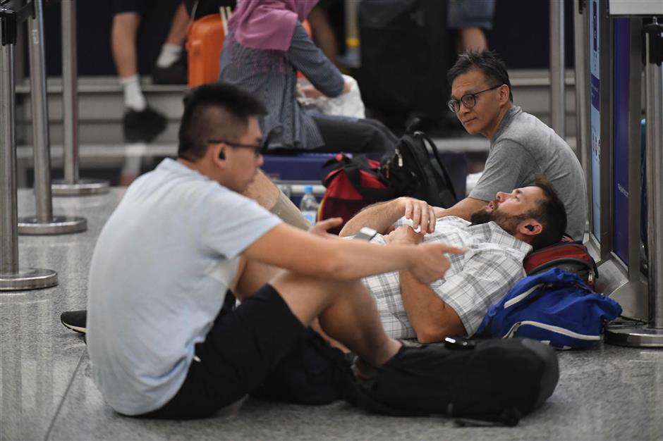 Hong Kong airport resumes operations with over 200 flights still cancelled