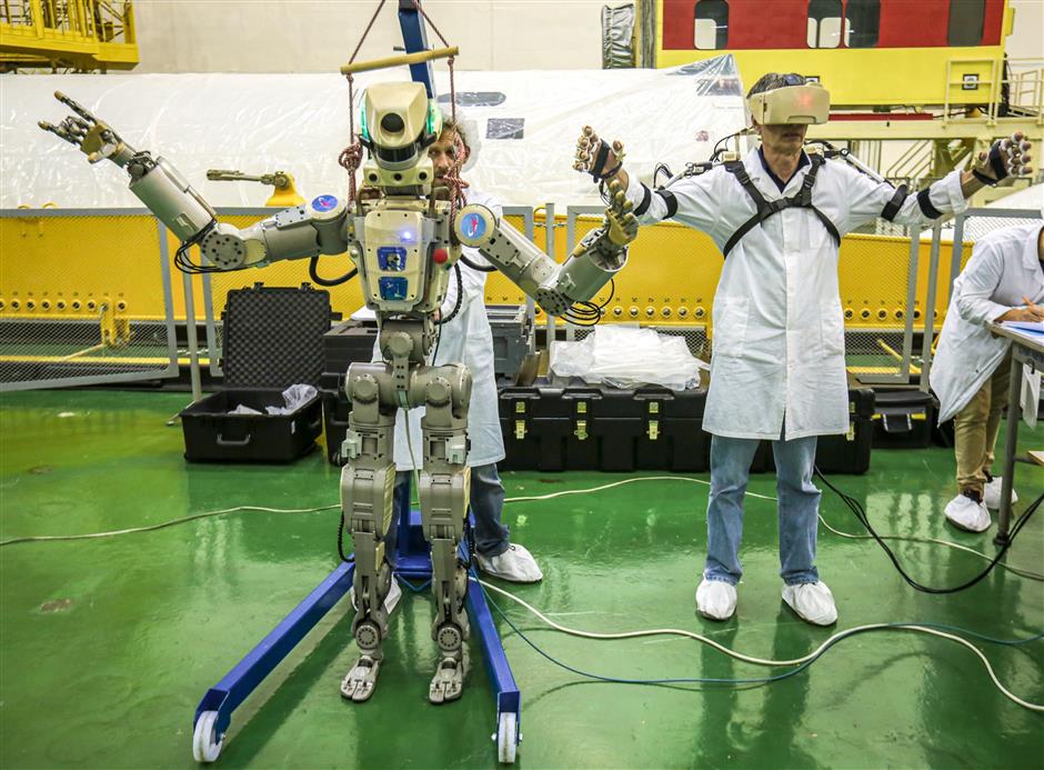 Russian spacecraft with humanoid robot docks at ISS