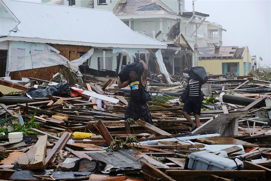 Bahamas staggers from Dorian's devastation, US southeast fears storm surge