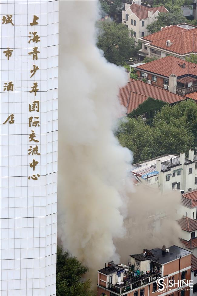 Historic shikumen blaze blankets Jing'an in smoke