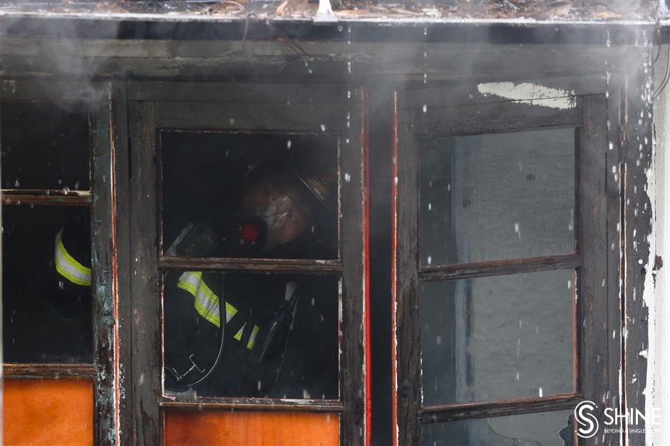 Historic shikumen blaze blankets Jing'an in smoke