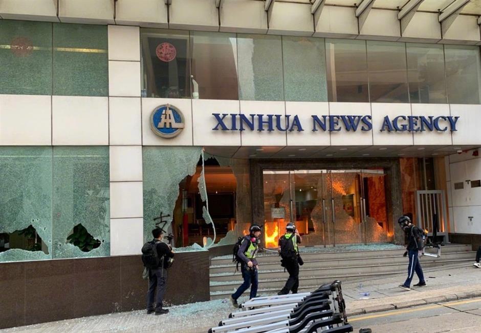 HKSAR acting chief executive condemns rioters' vandalism against Xinhua's office in HK