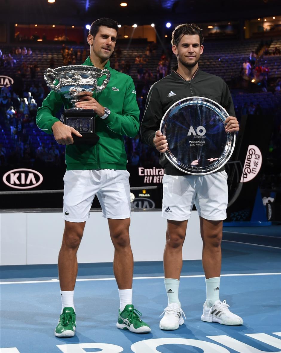 Djokovic beats Thiem in five-set epic to win eighth Australian Open