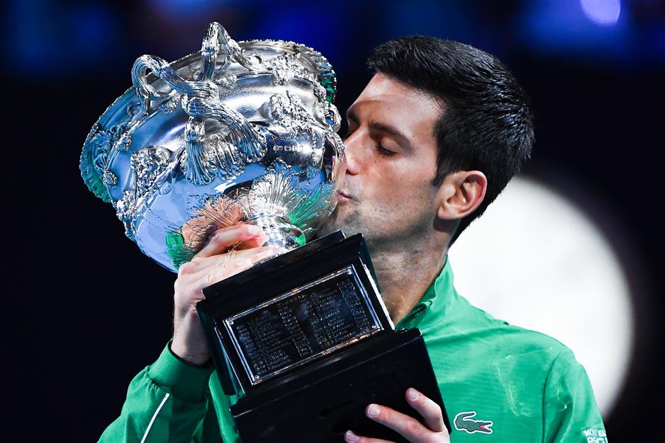 Djokovic beats Thiem in five-set epic to win eighth Australian Open