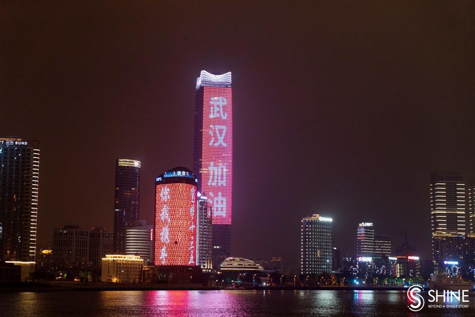 Both sides of the Huangpu River light up in support of Wuhan