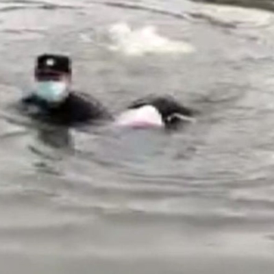 Officer jumps in river to save suicidal woman