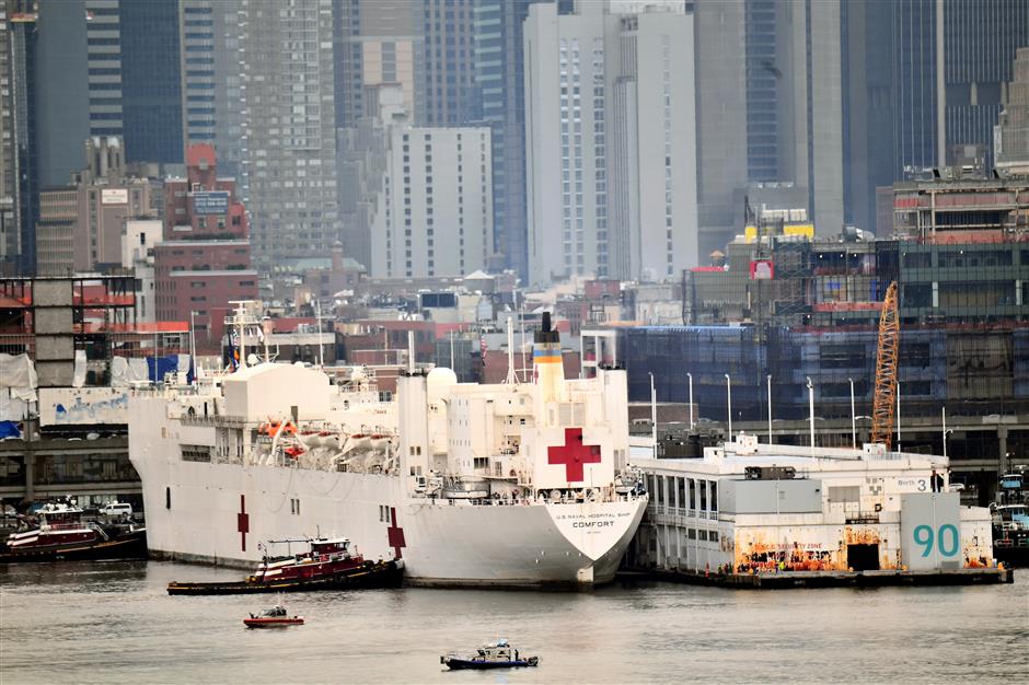 New York gets hospital ship as coronavirus accelerates in US