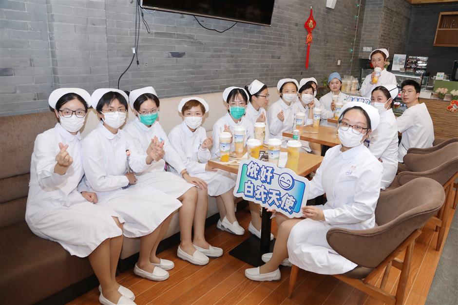 Shanghai's nurses celebrating with drinks