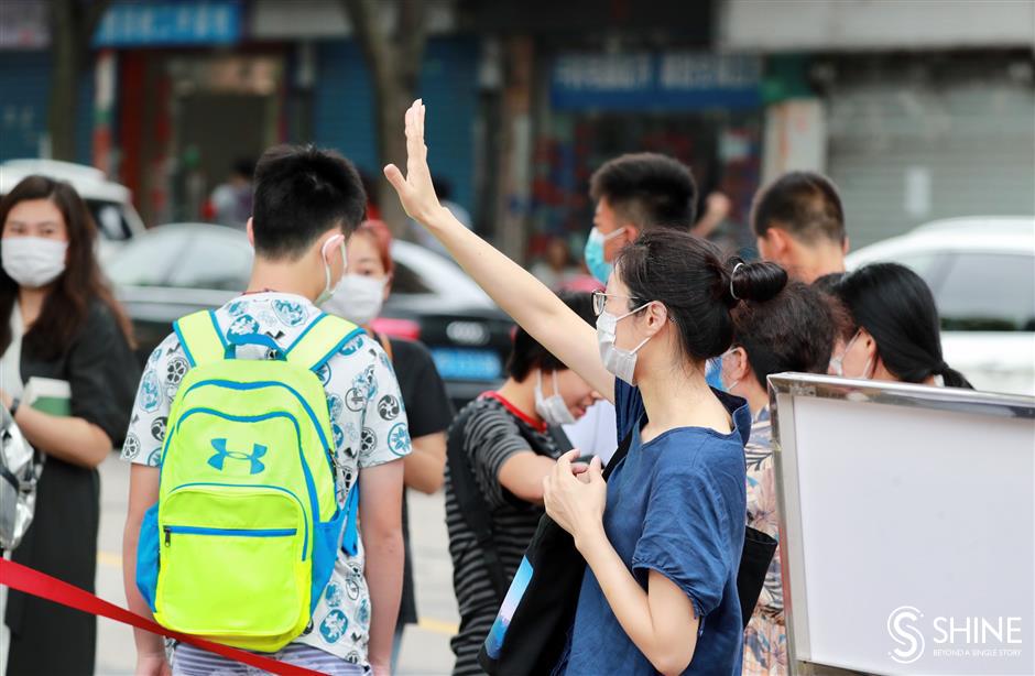 Cheers and good wishes as students take middle school exams