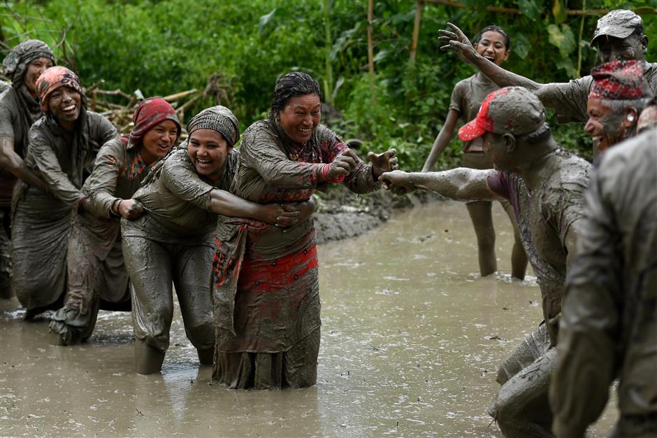 Playing and planting, Nepal celebrates paddy day