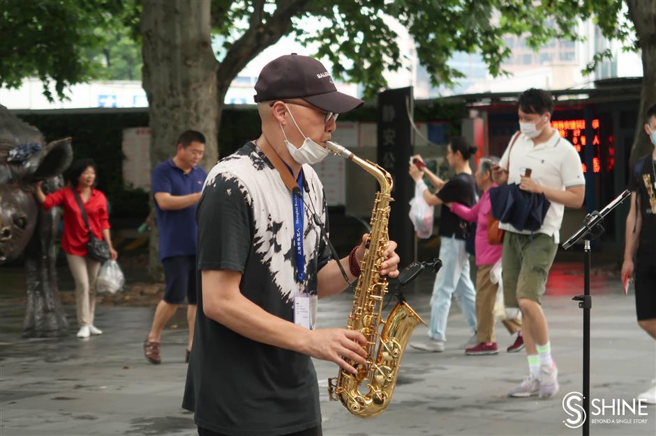 Licensed performers enliven city's streets