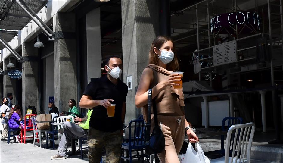 US sees record 52,000 new virus cases in 24 hours