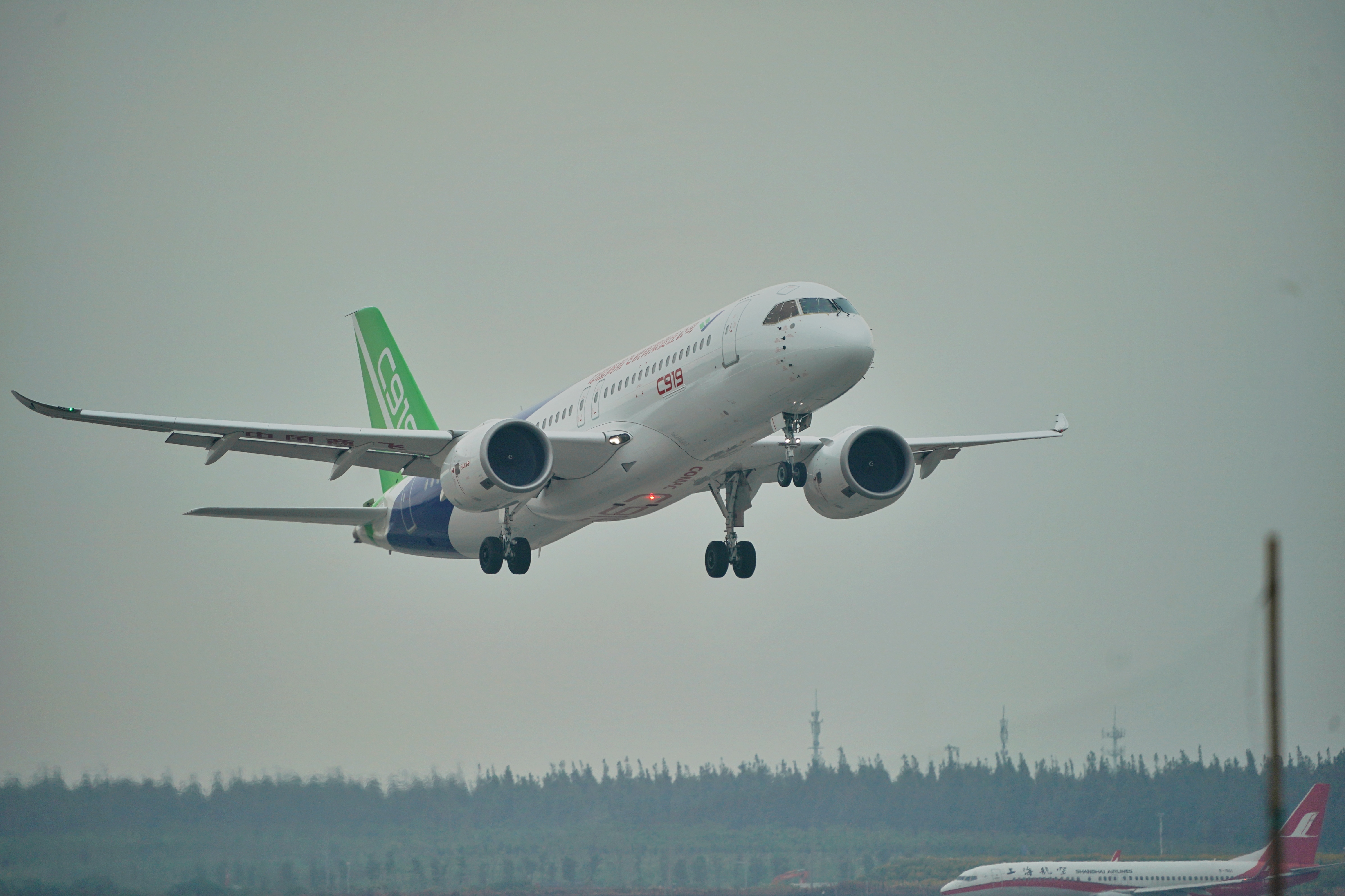 a c919 takes off from the pudong airport.