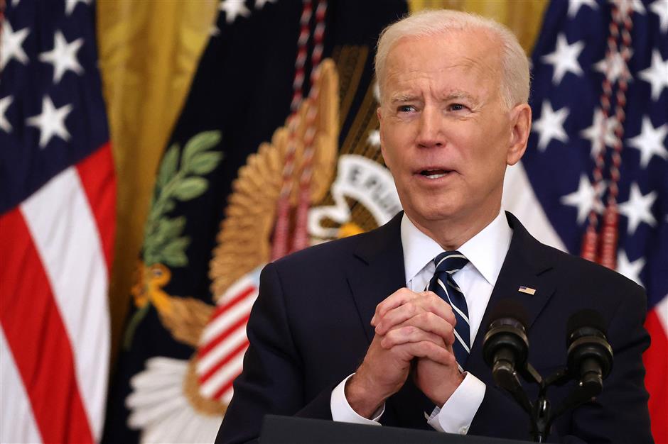 Biden doubles vaccine pledge, says plans to run again