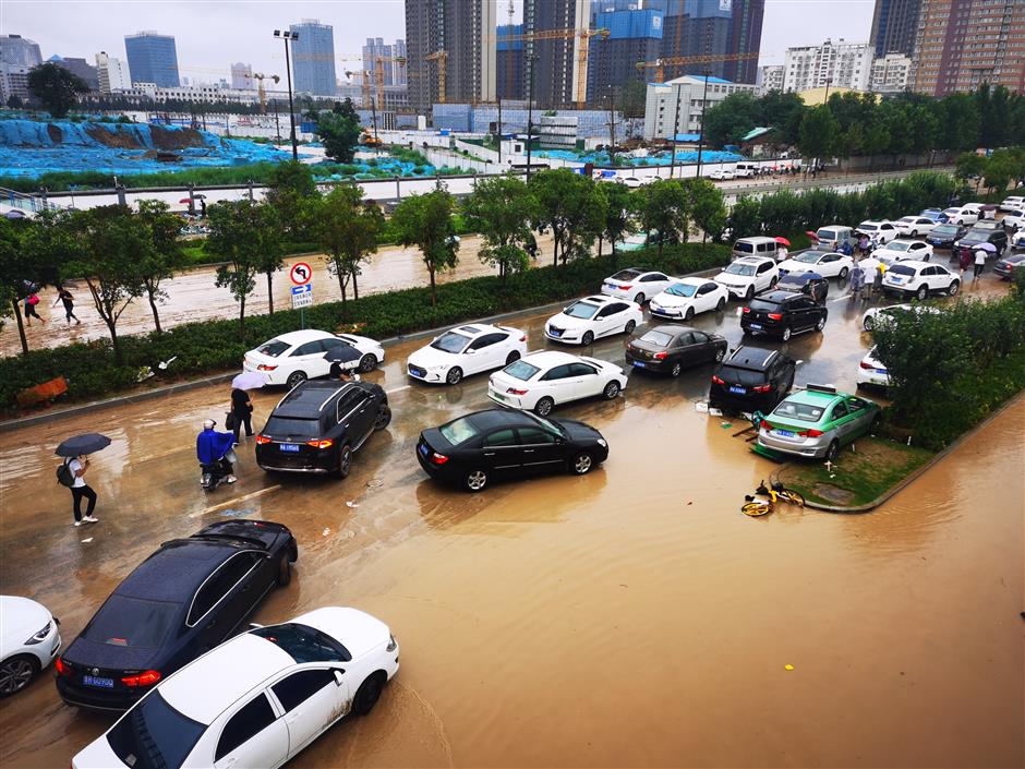 China on second-highest emergency response as downpours, flooding continue in central province