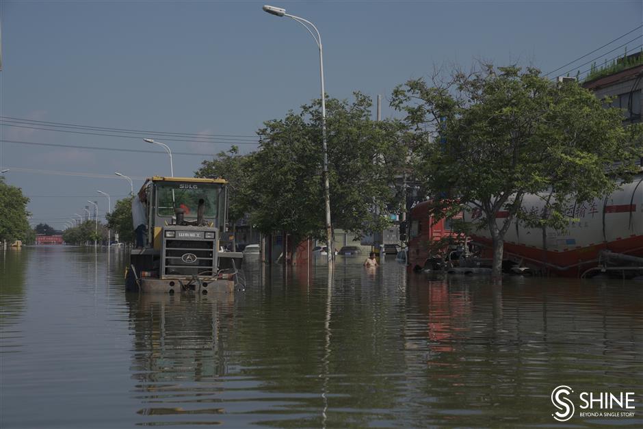 Flood waters still pose a threat for many villages in Henan