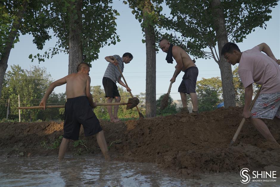 Flood waters still pose a threat for many villages in Henan