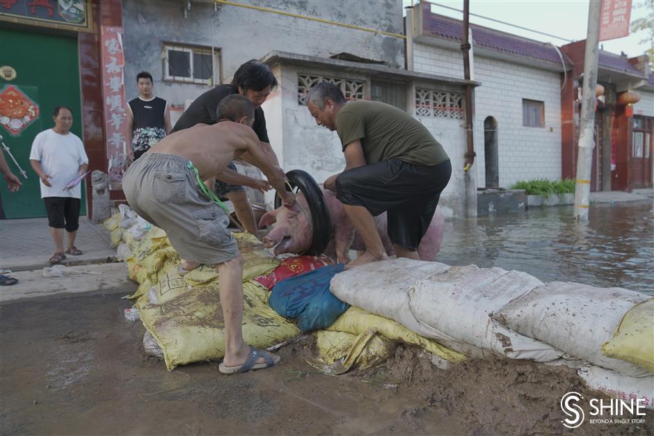 Flood waters still pose a threat for many villages in Henan