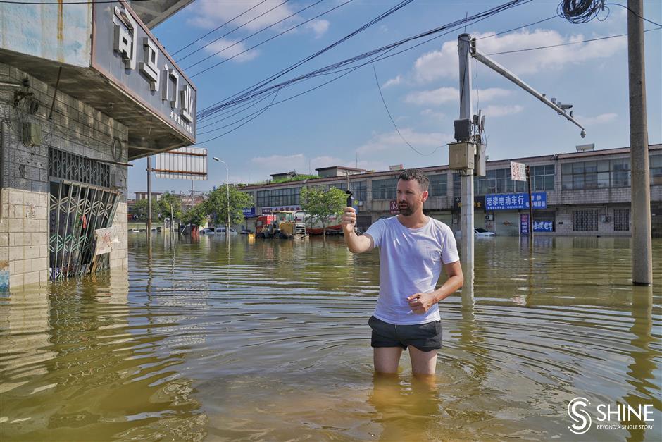 Villagers fight for their livelihoods as floodwaters lap at doorstep