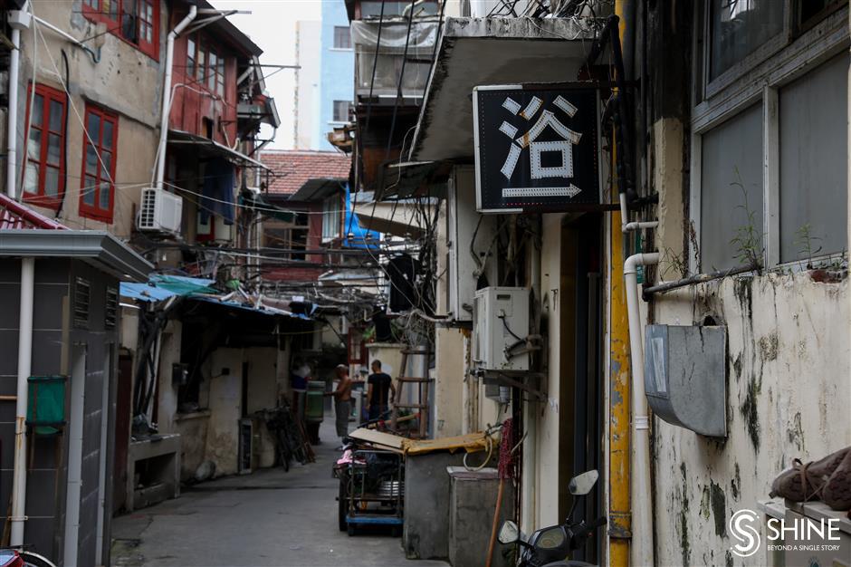 Clinging to memories as homes and shops disappear from old street