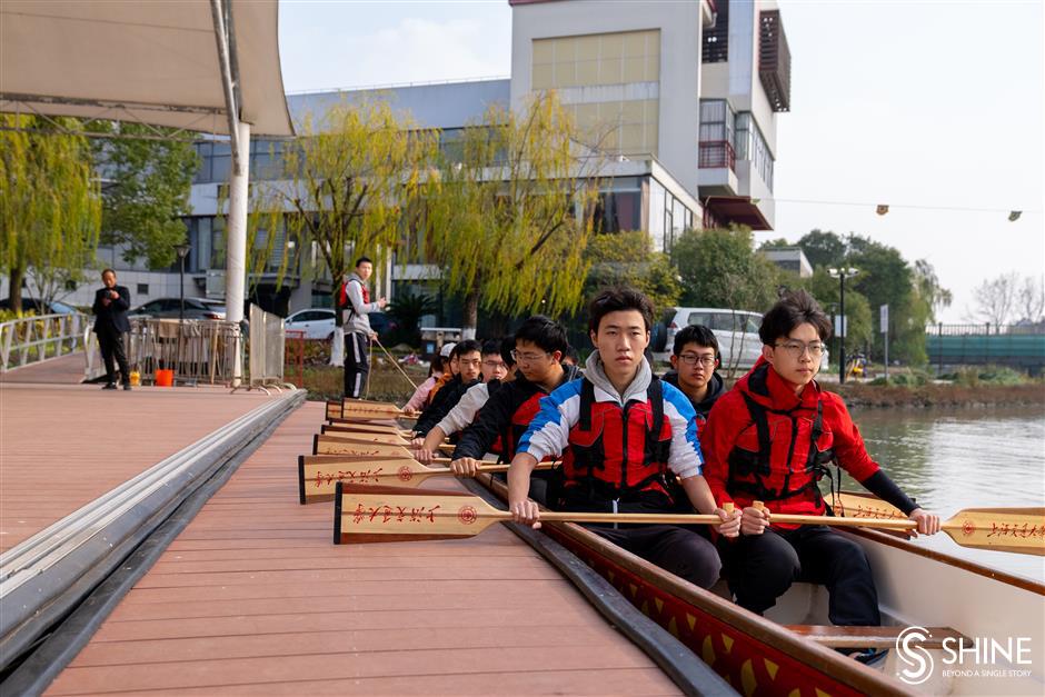 Varsity students ride the dragon boat wave