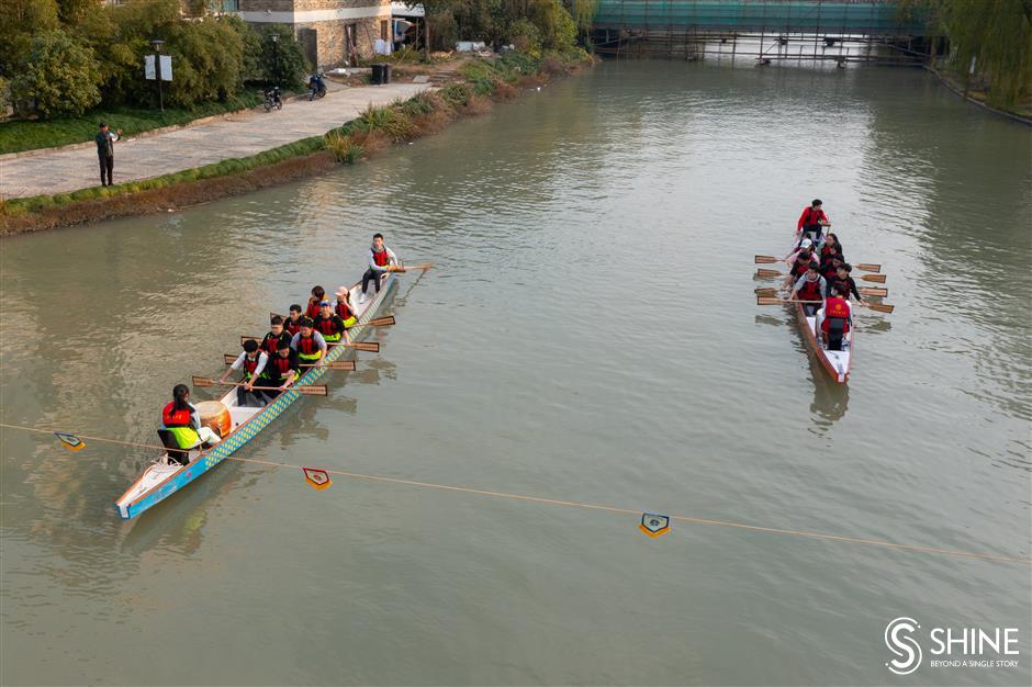 Varsity students ride the dragon boat wave