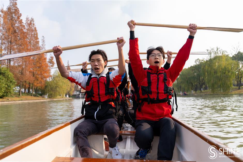 Varsity students ride the dragon boat wave