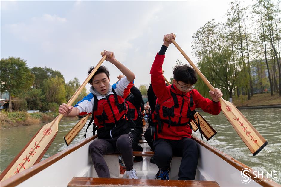 Varsity students ride the dragon boat wave