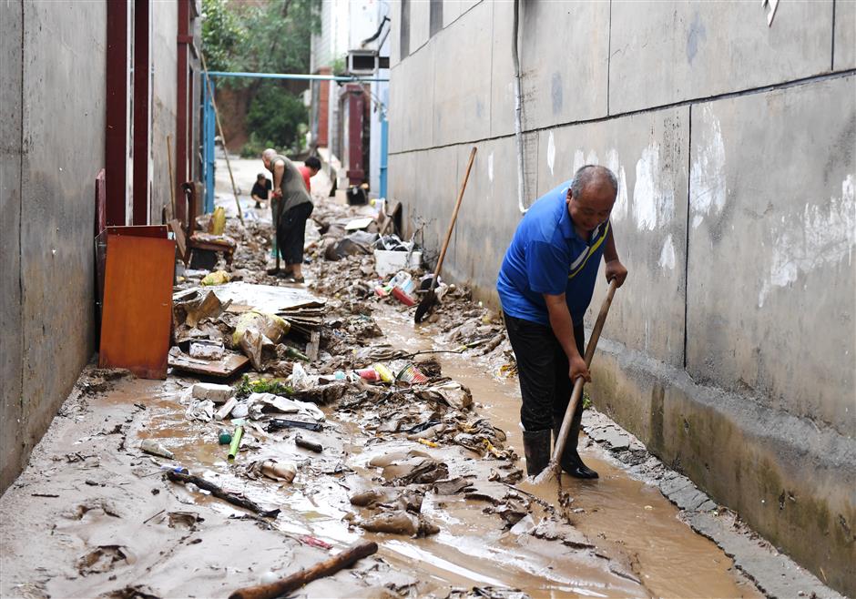 Xi urges all-out rescue efforts as rains kill 20