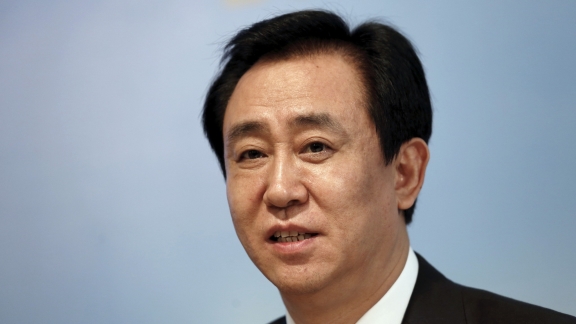 China to bar Evergrande chair from securities market for life