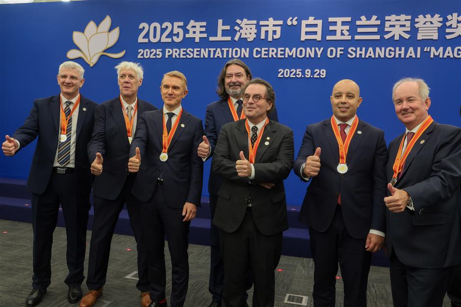 2 expatriates awarded honorary citizenship