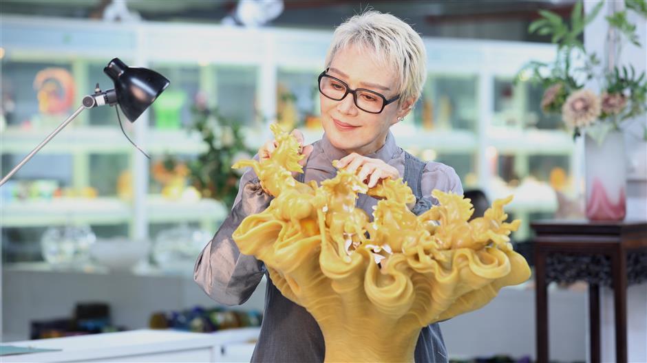 'Belief Defines Greatness'! Loretta Yang's Glass Horse Sculptures on Show