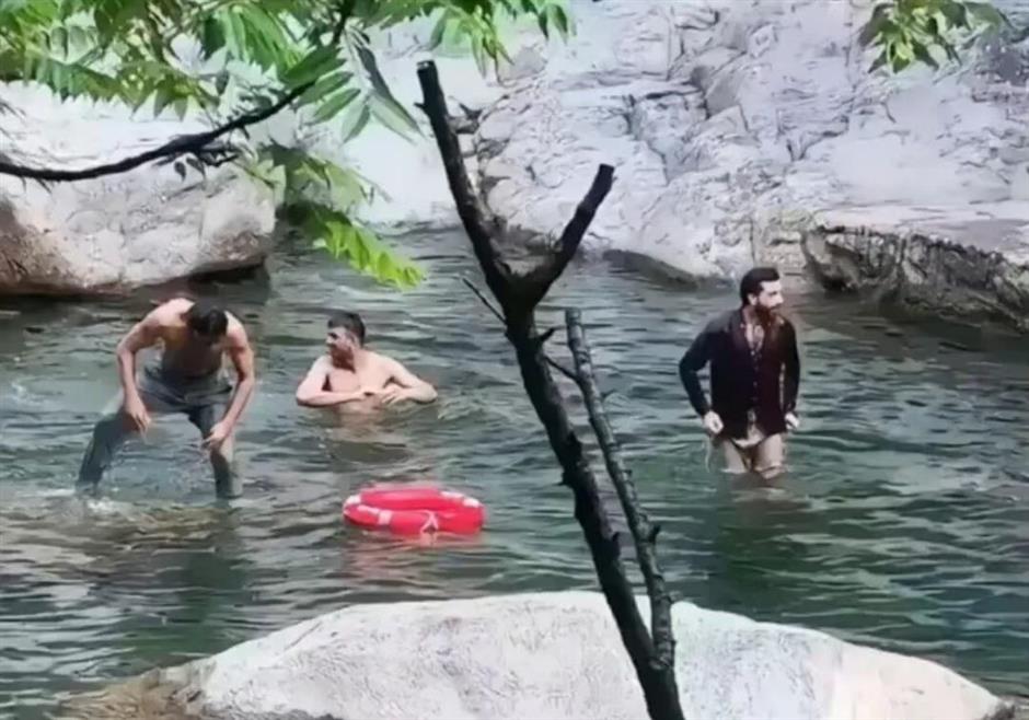 Three Foreign Tourists Spark Fury by Bathing in Restricted Chinese Scenic Pool