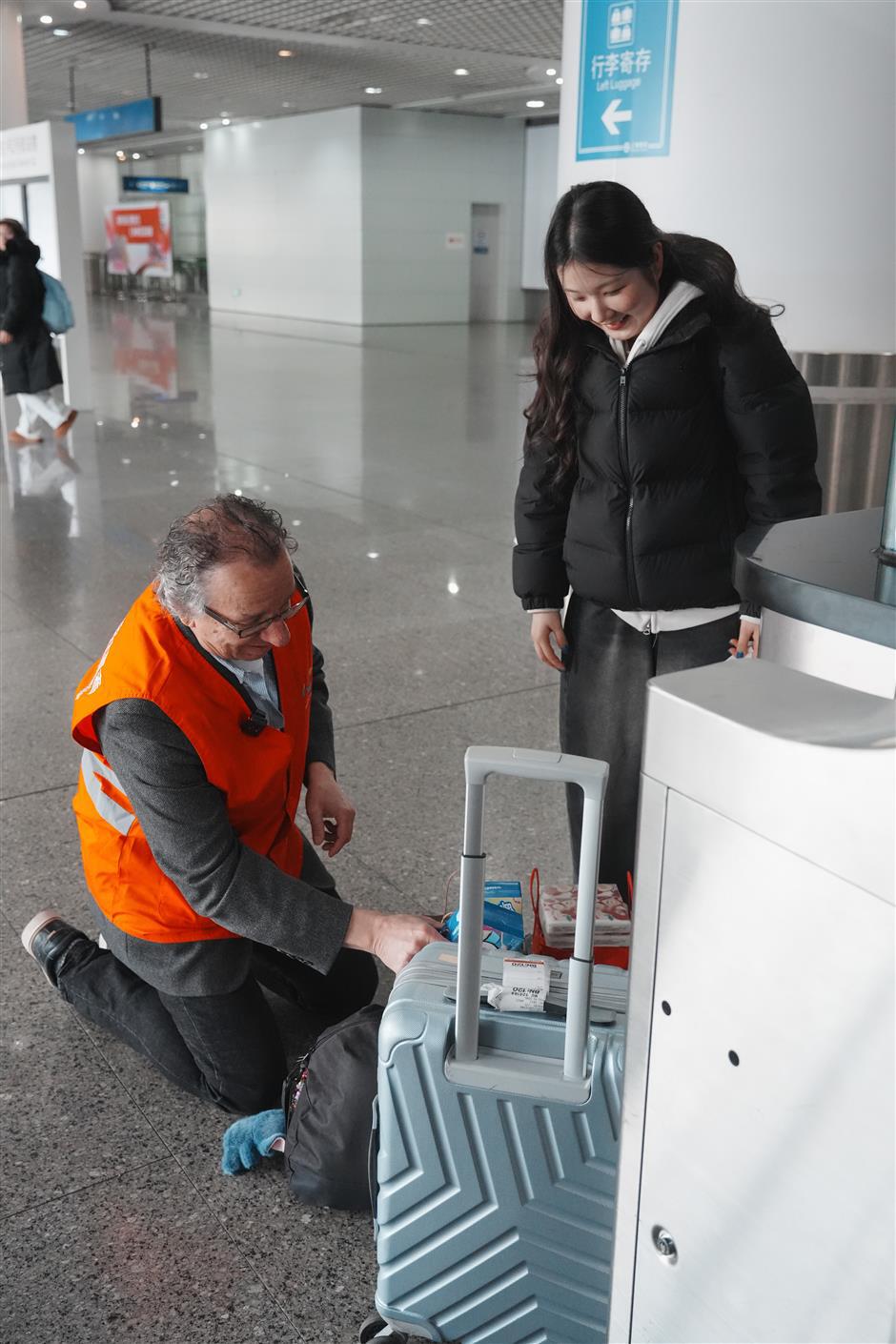 'You're On Your Way:' The American Professor Guiding Arrivals at Shanghai's Gates