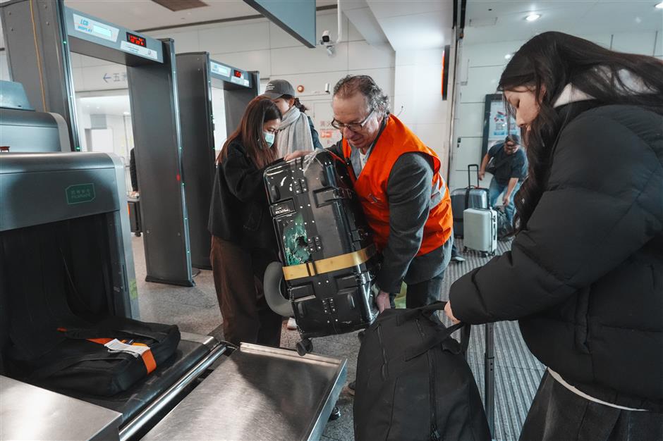 'You're On Your Way:' The American Professor Guiding Arrivals at Shanghai's Gates