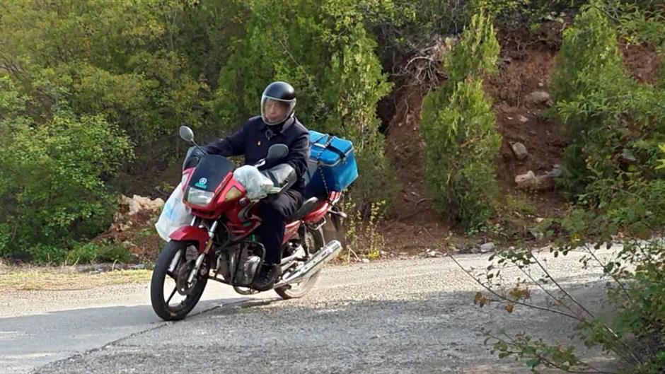 China's 'Mountain 120': After 70,000 Trips and 9 Motorbikes, This Rural Doctor Still Answers the Call