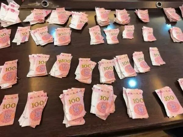 20 Days, 10,000 Fragments: Wuhan Bank Staff Piece Together Damaged Banknotes For Elderly Man