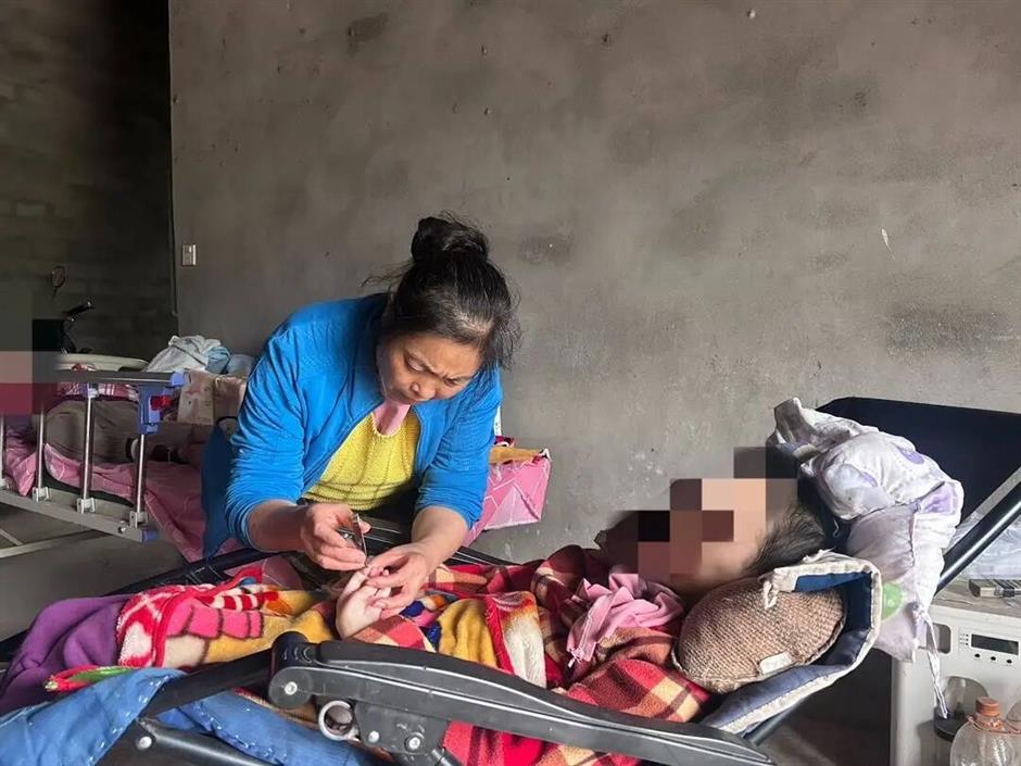 Sichuan Mother Refuses to Give Up on 2 Daughters With Cerebral Palsy